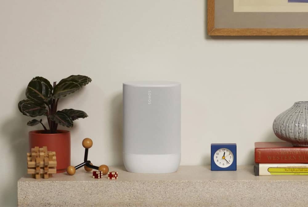 Image of a white Sonos Move 2 on a sideboard next to a plant